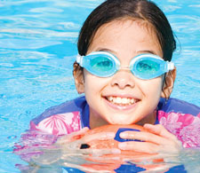 Child swimming with goggles